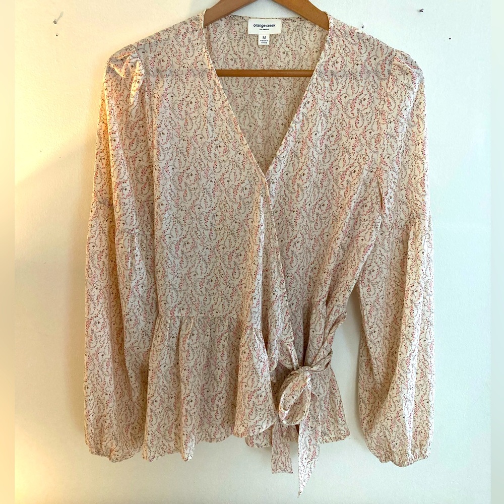 Medium, orange creek, cream colored shirt with pink flower pattern